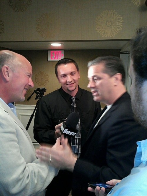 Jordan Griffith (center) interviewing national champion University of Kentucky head coach John Calipari last year